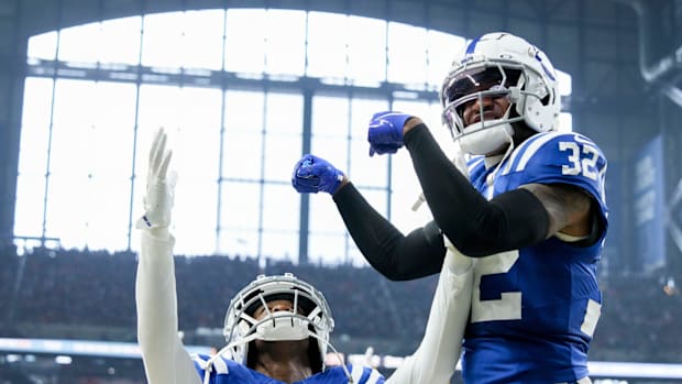 Indianapolis Colts safety Julian Blackmon (32) celebrates with Indianapolis Colts cornerback Jaylon Jones (40) and Jones