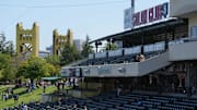 Apr 9, 2025; West Sacramento, California, USA; A general view of the first base stands and Tower bridge before the game between the Athletics and the San Diego Padres at Sutter Health Park. Mandatory Credit: Darren Yamashita-Imagn Images