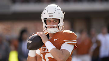 Texas Longhorns quarterback Arch Manning (16) warms up before a game against the Arkansas Razorbacks at Darrell K Royal-Texas Memorial Stadium.