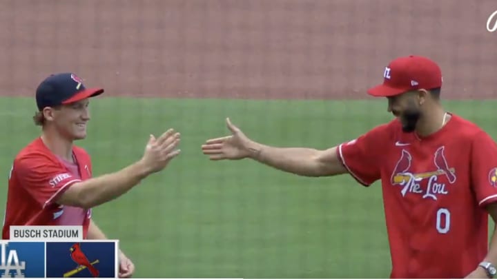 Matthew Tkachuk and Jayson Tatum throw the first pitch at Busch Stadium before the St. Louis Cardinals host the Los Angeles Dodgers.