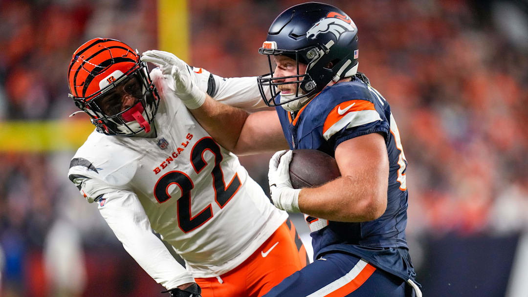 Denver Broncos tight end Adam Trautman (82) pushes off Cincinnati Bengals safety Geno Stone (22) on a catch in the second quarter of the NFL Week 4 Monday Night Football game between the Denver Broncos and the Cincinnati Bengals at Empower Field at Mile High in Denver on Monday, Sept. 29, 2025.