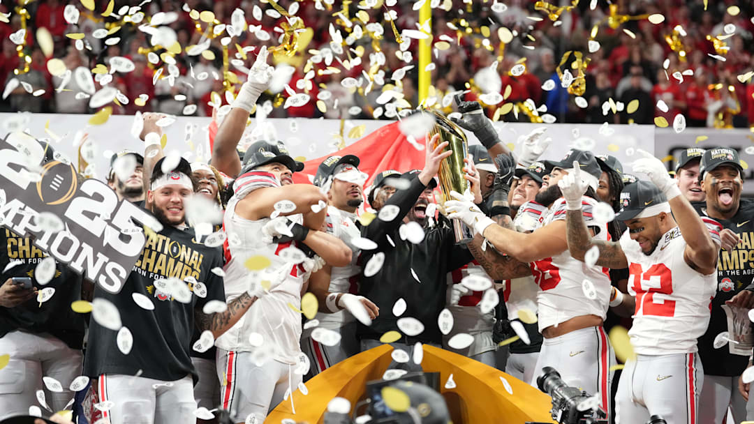 Jan 20, 2025; Atlanta, GA, USA; Ohio State Buckeyes hoist the CFP National Championship trophy after defeating the Notre Dame Fighting Irish in the CFP National Championship.