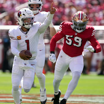 Oct 6, 2024; Santa Clara, California, USA; Arizona Cardinals quarterback Kyler Murray (1) gestures while rushing for a touchdown against the San Francisco 49ers linebacker De'Vondre Campbell (59) during the first quarter at Levi's Stadium. Mandatory Credit: Darren Yamashita-Imagn Images