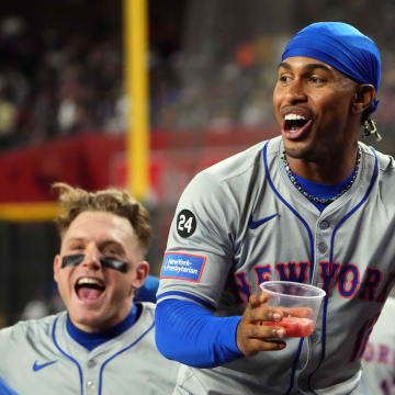 Aug 28, 2024; Phoenix, Arizona, USA; New York Mets shortstop Francisco Lindor (12) and New York Mets outfielder Harrison Bader (44) celebrate against the Arizona Diamondbacks during the sixth inning at Chase Field.