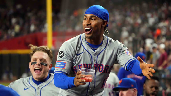 Aug 28, 2024; Phoenix, Arizona, USA; New York Mets shortstop Francisco Lindor (12) and New York Mets outfielder Harrison Bader (44) celebrate against the Arizona Diamondbacks during the sixth inning at Chase Field.