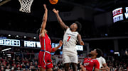 Cincinnati Bearcats guard Keyshuan Tillery (7) lays up a shot against NJIT Highlanders forward Jordan Rogers (3) in the first half of the NCAA men’s basketball game between the Cincinnati Bearcats and the NJIT Highlanders at Fifth Third Arena in Cincinnati on Monday, Nov. 24, 2025.