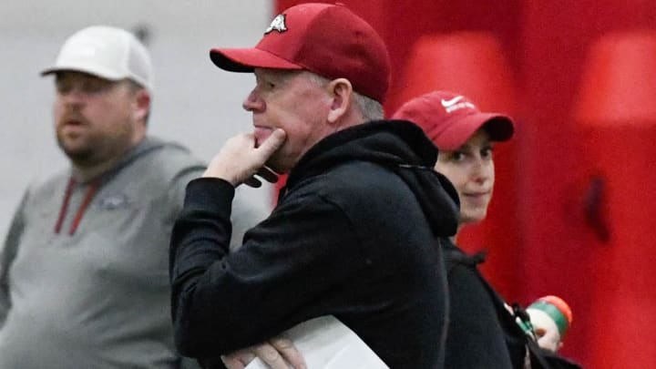 Arkansas Razorbacks offensive coordinator Bobby Petrino watching quarterbacks at a spring practice March 8 on the indoor practice field in Fayetteville, Ark.
