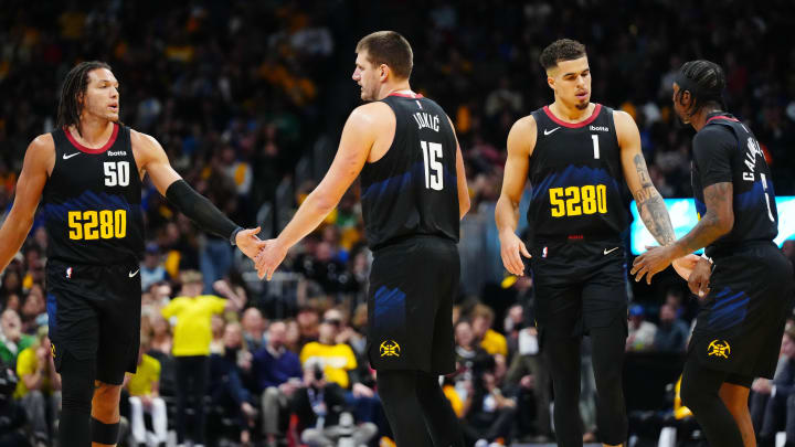 Denver Nuggets forward Aaron Gordon (50), center Nikola Jokic (15), forward Michael Porter Jr. (1) and guard Kentavious Caldwell-Pope (5) celebrate a score in the second half against the Dallas Mavericks at Ball Arena. Mandatory Credit: