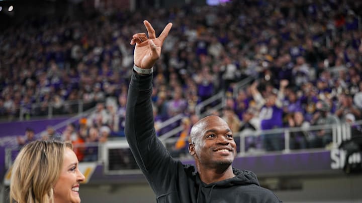 Adrian Peterson waves to the crowd during a 2023 Vikings game. Adrian Peterson waves to the crowd during a 2023 Vikings game.