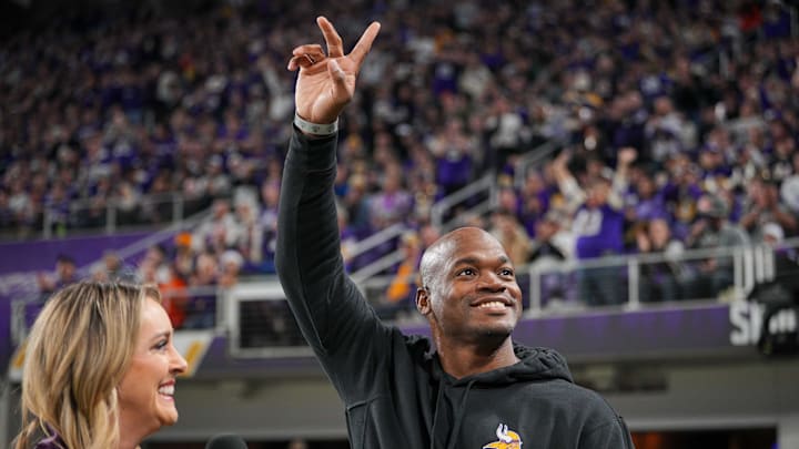 Ex-Minnesota Viking Adrian Peterson salutes the crowd in the third quarter in a game against the Chicago Bears at U.S. Bank Stadium in Minneapolis on Nov. 27, 2023.