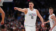 Mar 7, 2025; Denver, Colorado, USA; Denver Nuggets center Nikola Jokic (15) points in the second half against the Phoenix Suns at Ball Arena. Mandatory Credit: Ron Chenoy-Imagn Images