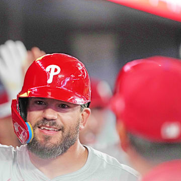 Philadelphia Phillies designated hitter Kyle Schwarber (12) hits a three-run home run and celebrates in the dugout against the Toronto Blue Jays during the ninth inning at Rogers Centre.