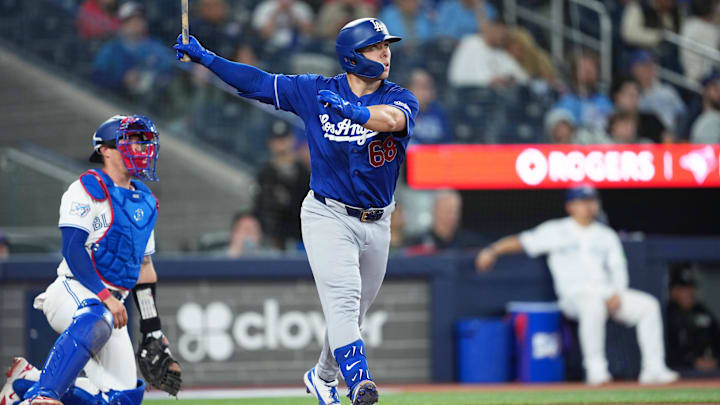 Apr 6, 2026; Toronto, Ontario, CAN; Los Angeles Dodgers catcher Dalton Rushing (68) hits a home run against the Toronto Blue Jays during the eighth inning at Rogers Centre. Mandatory Credit: Nick Turchiaro-Imagn Images