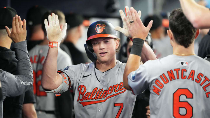 Aug 7, 2024; Toronto, Ontario, CAN; Baltimore Orioles second baseman Jackson Holliday (7) celebrates in the dugout after hitting a two run home run against the Toronto Blue Jays during the seventh inning at Rogers Centre.