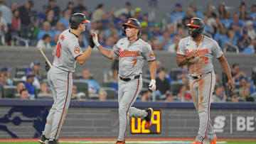 Aug 7, 2024; Toronto, Ontario, CAN; Baltimore Orioles second baseman Jackson Holliday (7) hits a two run home run and celebrates with  third baseman Coby Mayo (16) against the Toronto Blue Jays during the seventh inning at Rogers Centre. 