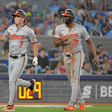 Aug 7, 2024; Toronto, Ontario, CAN; Baltimore Orioles second baseman Jackson Holliday (7) hits a two run home run and celebrates with  third baseman Coby Mayo (16) against the Toronto Blue Jays during the seventh inning at Rogers Centre. 