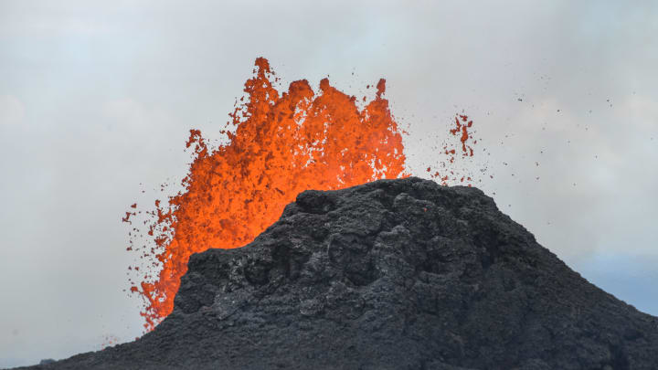 May 24, 2018; Pahoa, HI, USA; Lava shoots in the air out of a fissure in the ground in the Leilani Estates subdivision. The Kilauea volcano erupted on May 3 and has destroyed 24 homes and 2,000 people have been evacuated.