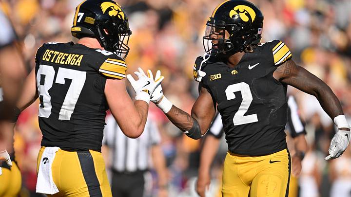 Sep 7, 2024; Iowa City, Iowa, USA; Iowa Hawkeyes tight end Addison Ostrenga (87) and running back Kaleb Johnson (2) react after a touchdown by Johnson during the third quarter against the Iowa State Cyclones at Kinnick Stadium. Mandatory Credit: Jeffrey Becker-Imagn Images