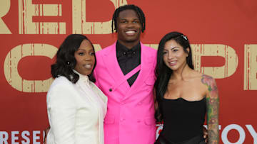 Colorado Buffaloes wide receiver Travis Hunter with his mother Ferrante Harris and his fiancee Leanna Lenee on the red carpet before the 2025 NFL Draft at Lambeau Field. 