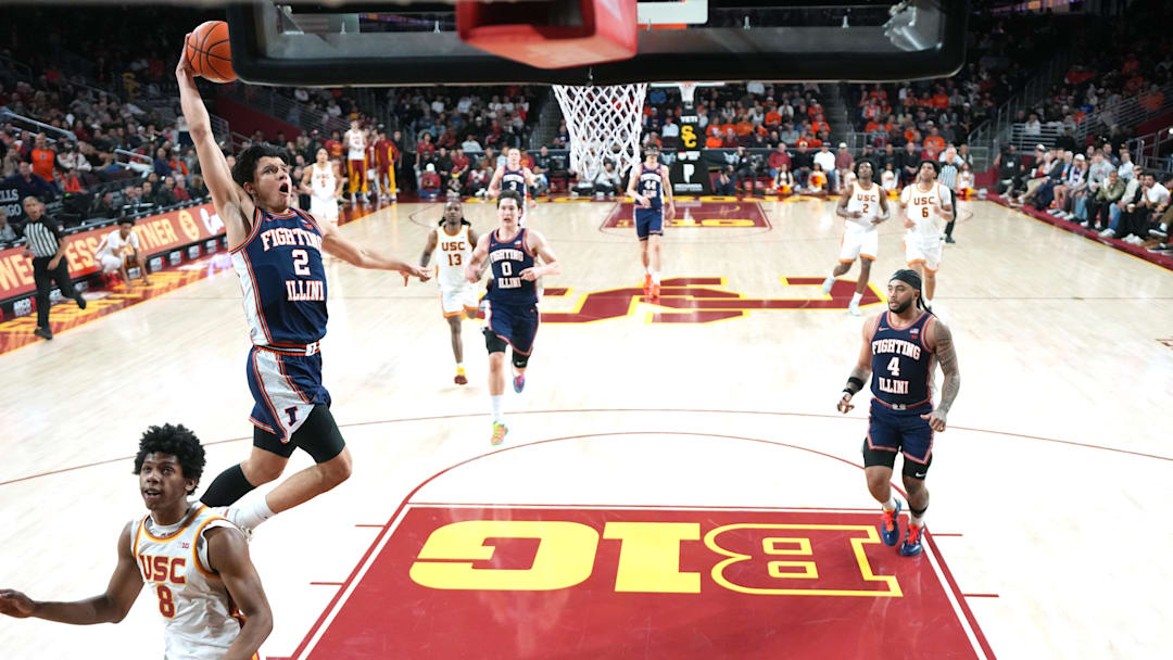 Feb 18, 2026; Los Angeles, California, USA; Illinois Fighting Illini guard Andrej Stojakovic (2) dunks the ball against Southern California Trojans guard Jerry Easter II (8) in the second half at Galen Center. Mandatory Credit: Kirby Lee-Imagn Images