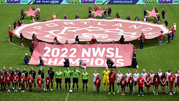 The Portland Thorns are recognized as 2022 NWSL Champions before a game against the Orlando Pride in 2023.