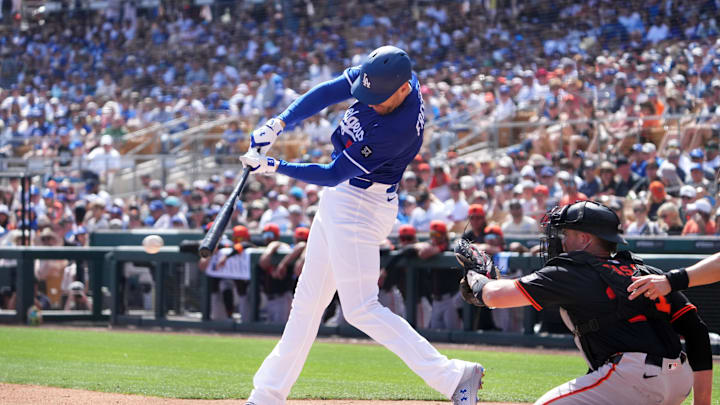 Mar 1, 2025; Phoenix, Arizona, USA; Los Angeles Dodgers first base Freddie Freeman (5) bats against the San Francisco Giants during the first inning at Camelback Ranch-Glendale. Mandatory Credit: Joe Camporeale-Imagn Images