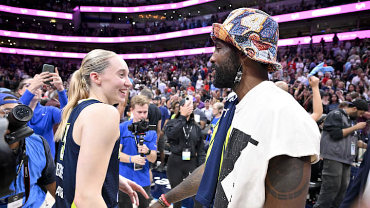 Jun 27, 2025; Dallas, Texas, USA; Dallas Mavericks point guard Kyrie Irving talks with Dallas Wings guard Paige Bueckers (5) after the game against the Indiana Fever at the American Airlines Center. Mandatory Credit: Jerome Miron-Imagn Images