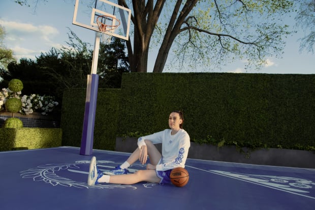 Breanna Stewart models blue and white PUMA gear.