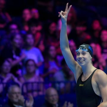 Gretchen Walsh celebrates after winning the 100-meter butterfly final Sunday, June 16, 2024, during the first day of competition for the U.S. Olympic Team Swimming Trials at Lucas Oil Stadium in Indianapolis.