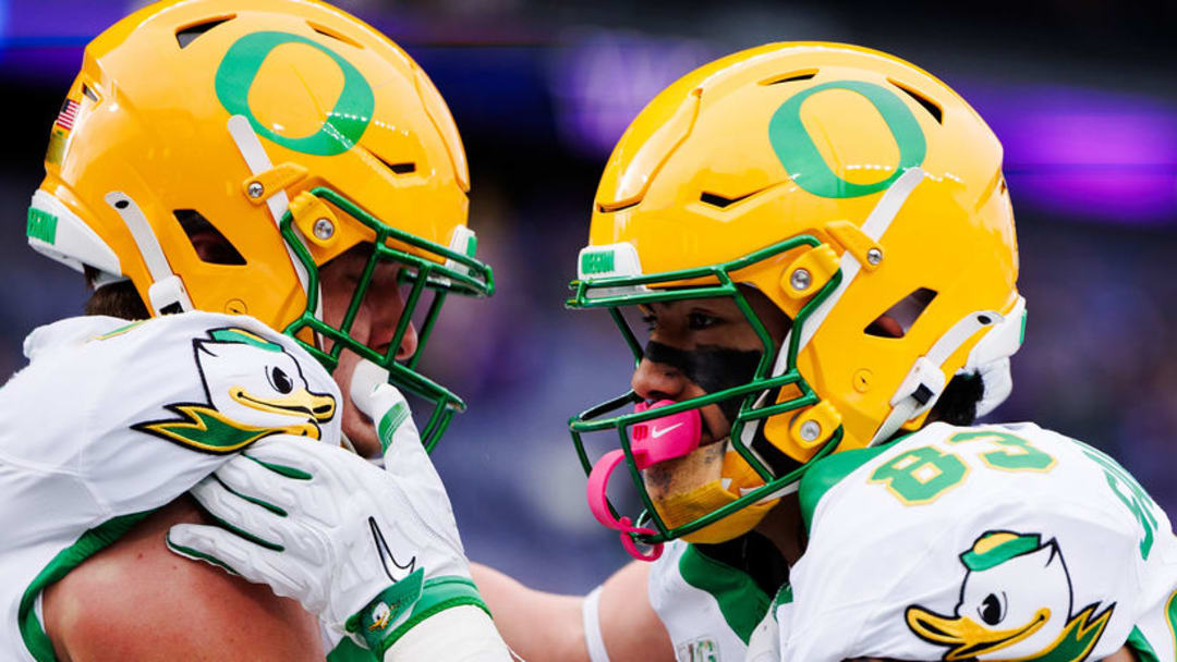 Oregon Ducks Washington Huskies uniforms nike phil knight husky stadium dan lanning NIL jedd fisch akili smith rivalry college football playoff