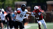 Cincinnati Bearcats tight end Joe Royer (11) stiff arms Miami Redhawks linebacker Oscar McWood (23) before the play is called back for holding in the fourth quarter of the College Football game at Yager Stadium in Cincinnati on Saturday, Sept. 14, 2024.