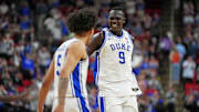 Mar 23, 2025; Raleigh, NC, USA; Duke Blue Devils guard Tyrese Proctor (5) and Duke Blue Devils center Khaman Maluach (9) reacts after a play against the Baylor Bears during the second half in the second round of the NCAA Tournament at Lenovo Center. Mandatory Credit: Bob Donnan-Imagn Images