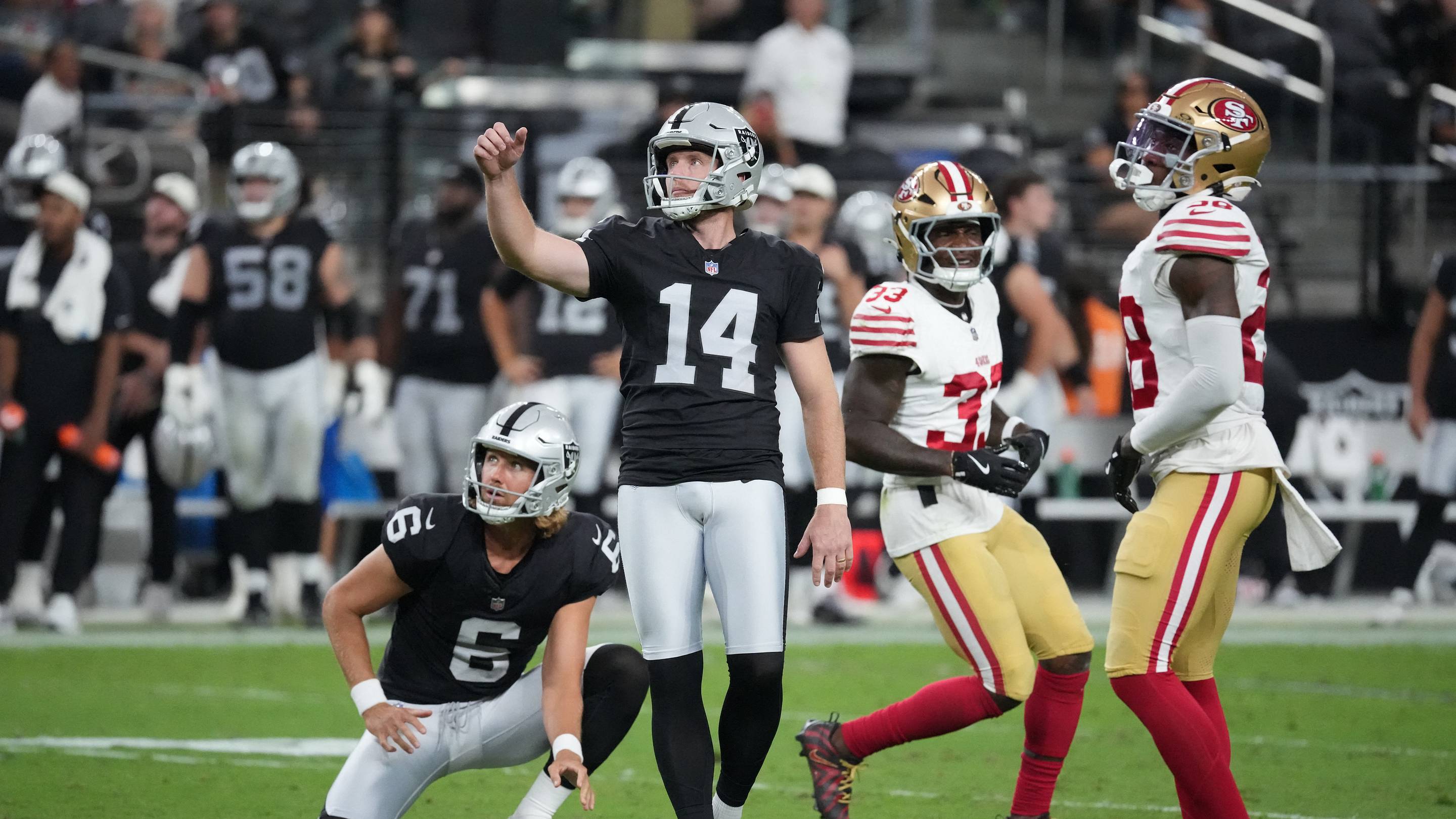 Aug 27, 2026; Paradise, Nevada, USA; Las Vegas Raiders placekicker Matt Gay (14) watches the ball after kicking a forty-five yard field goal held by punter AJ Cole (6) against the Las Vegas Raiders during the second quarter at Allegiant Stadium. Mandatory Credit: Kirby Lee