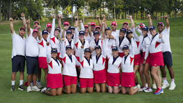 Members of Team USA and their caddies after defeating Team Europe in the 2024 Solheim Cup.