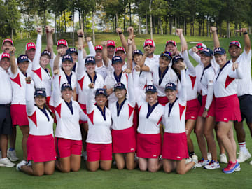 Members of Team USA and their caddies after defeating Team Europe in the 2024 Solheim Cup.