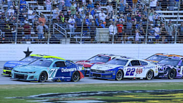 May 4, 2025; Fort Worth, Texas, USA; NASCAR Cup Series driver Michael McDowell (71) and driver Ryan Blaney (12) and driver Joey Logano (22) and driver Kyle Larson (5) drives during a restart of the Wurth 400 race at Texas Motor Speedway. Mandatory Credit: Jerome Miron-Imagn Images