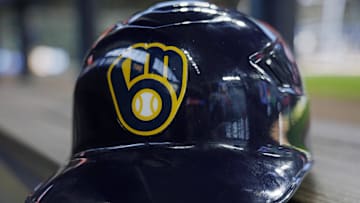 Jun 10, 2024; Milwaukee, Wisconsin, USA;  A Milwaukee Brewers batting helmet sits on the bench during batting practice prior to the game against the Toronto Blue Jays at American Family Field. Mandatory Credit: Jeff Hanisch-Imagn Images
