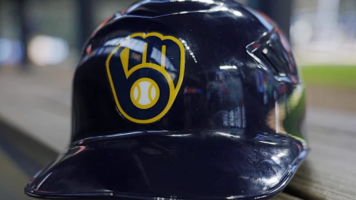 Jun 10, 2024; Milwaukee, Wisconsin, USA; A Milwaukee Brewers batting helmet sits on the bench during batting practice prior to the game against the Toronto Blue Jays at American Family Field. Mandatory Credit: Jeff Hanisch-Imagn Images Jun 10, 2024; Milwaukee, Wisconsin, USA; A Milwaukee Brewers batting helmet sits on the bench during batting practice prior to the game against the Toronto Blue Jays at American Family Field. Mandatory Credit: Jeff Hanisch-Imagn Images