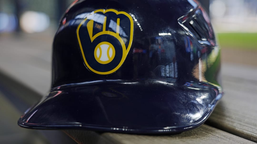 Jun 10, 2024; Milwaukee, Wisconsin, USA;  A Milwaukee Brewers batting helmet sits on the bench during batting practice prior to the game against the Toronto Blue Jays at American Family Field. Mandatory Credit: Jeff Hanisch-USA TODAY Sports