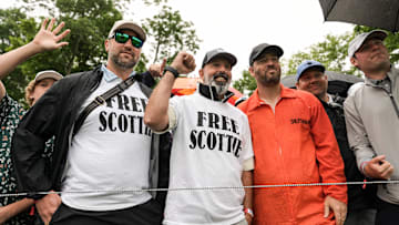 Spectators who did not want to be identified wore Free Scottie T-shirts and one wore an orange jumpsuit like shown in the Louisville Metro Corrections mug shot of professional golfer Scottie Scheffler at the 2024 PGA Championship second round Friday at Valhalla Golf Course in Louisville, Kentucky. May 17, 2024. Scheffler was arrested early Friday morning on charges of second-degree assault, third-degree criminal mischief, reckless driving and disregarding signals from an officer directing