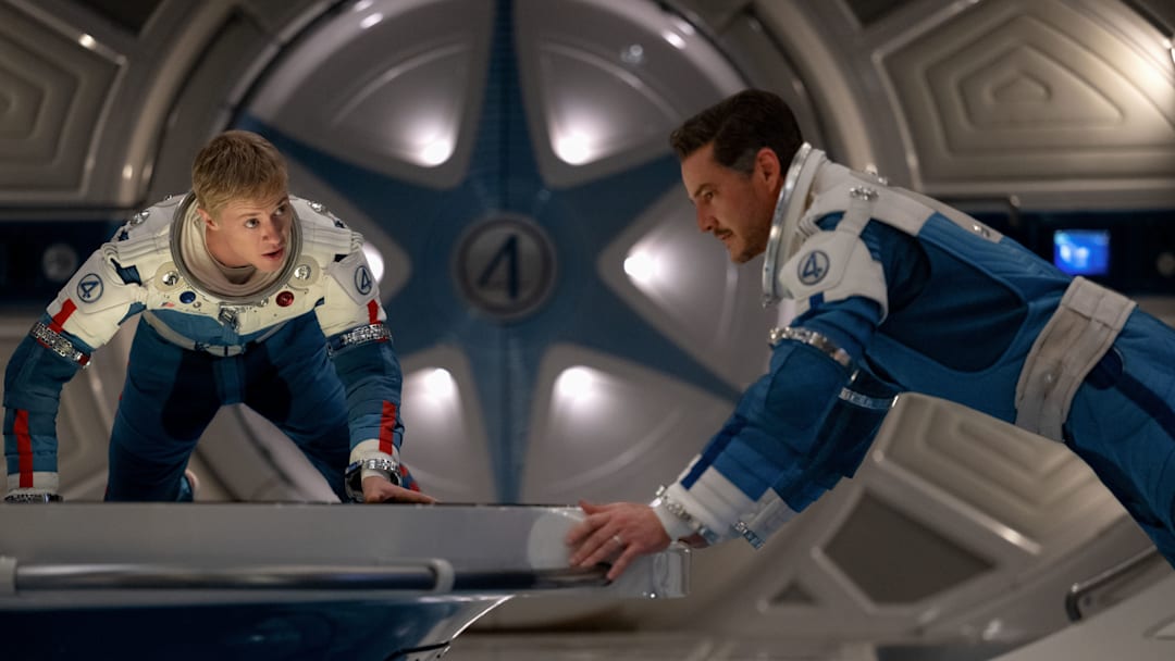 (L-R) Joseph Quinn as Johnny Storm/Human Torch and Pedro Pascal as Reed Richards/Mister Fantasticin 20th Century Studios/Marvel Studios' THE FANTASTIC FOUR: FIRST STEPS. Photo courtesy of 20th Century Studios/Marvel Studios. © 2025 20th Century Studios / © and ™ 2025 MARVEL.