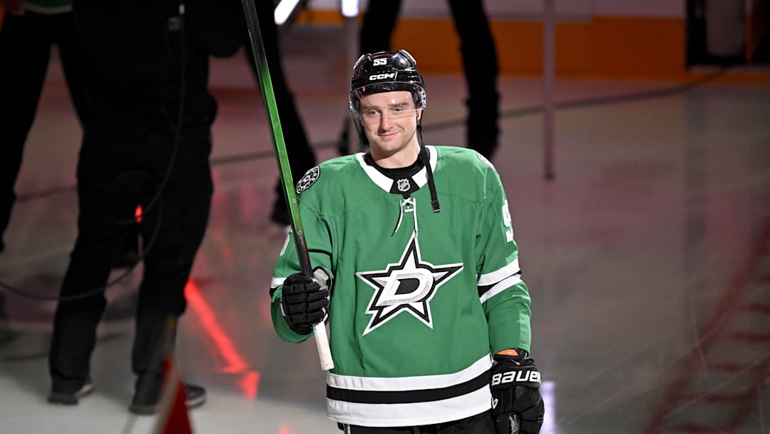 Feb 4, 2026; Dallas, Texas, USA; Dallas Stars defenseman Thomas Harley (55) takes the ice as the Stars celebrate their 2026 Winter Olympics hockey players before the game against the St. Louis Blues at the American Airlines Center. Mandatory Credit: Jerome Miron-Imagn Images