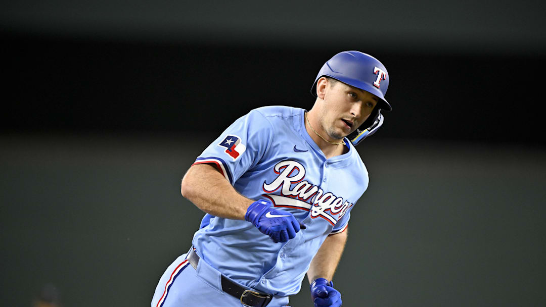 Sep 21, 2025; Arlington, Texas, USA; Texas Rangers left fielder Wyatt Langford (36) rounds the bases after he hits a home run against the Miami Marlins during the sixth inning at Globe Life Field. Mandatory Credit: Jerome Miron-Imagn Images