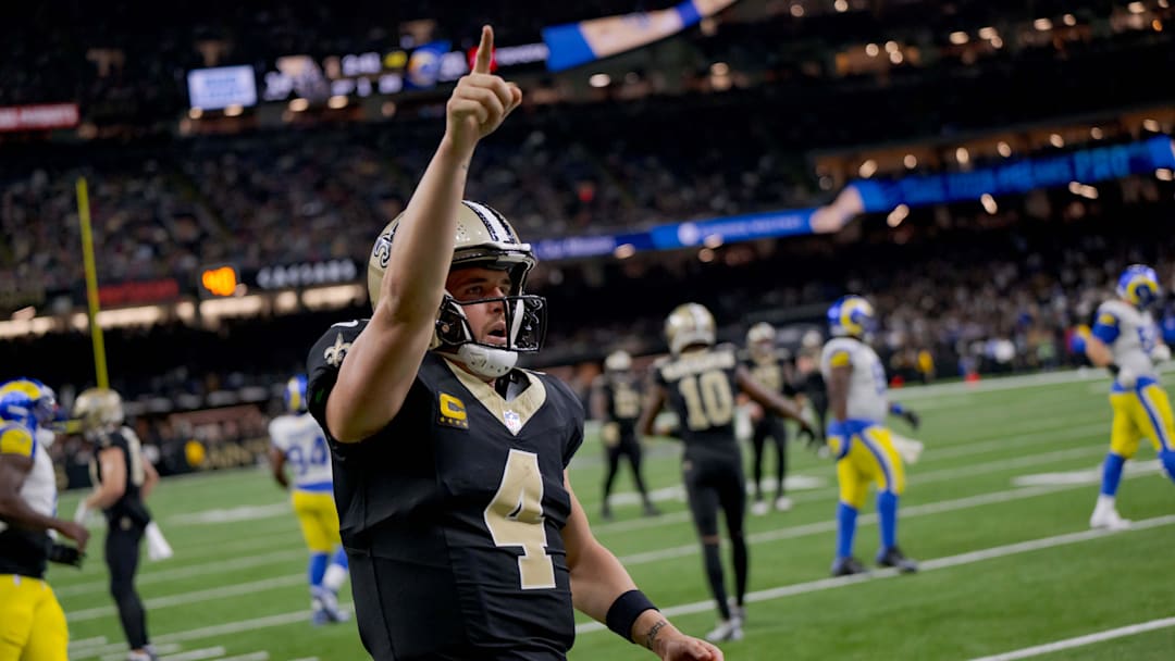 Dec 1, 2024; New Orleans, Louisiana, USA; New Orleans Saints quarterback Derek Carr (4) reacts after rushing for a first down against the Los Angeles Rams during the fourth quarter at Caesars Superdome. Mandatory Credit: Matthew Hinton-Imagn Images