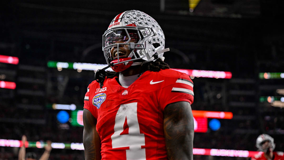 Dec 31, 2025; Arlington, TX, USA; Ohio State Buckeyes wide receiver Jeremiah Smith (4) celebrates after he runs for a touchdown during the 2025 Cotton Bowl and quarterfinal game of the College Football Playoff at AT&T Stadium. Mandatory Credit: Jerome Miron-Imagn Images