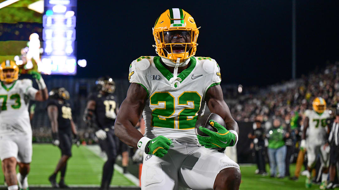 Oct 18, 2024; West Lafayette, Indiana, USA; Oregon Ducks running back Jay Harris (22) celebrates scoring a touchdown during the second half against the Purdue Boilermakers at Ross-Ade Stadium. Mandatory Credit: Marc Lebryk-Imagn Images
