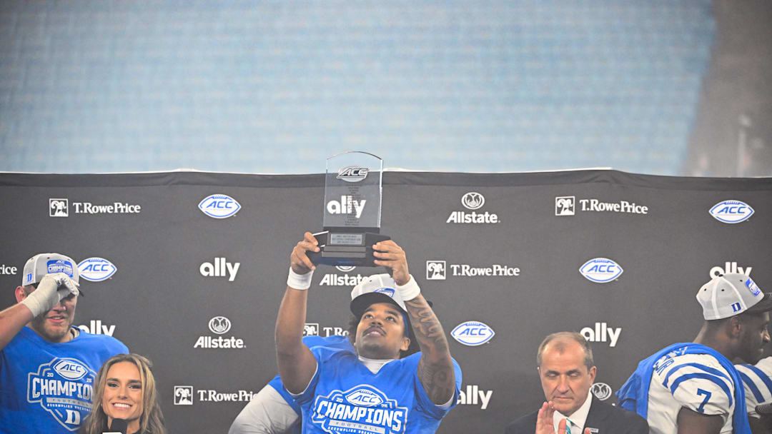 Dec 6, 2025; Charlotte, NC, USA; Duke Blue Devils quarterback Darian Mensah (10) celebrates defeating the Virginia Cavaliers during the 2025 ACC Championship game at Bank of America Stadium. Mandatory Credit: Jim Dedmon-Imagn Images