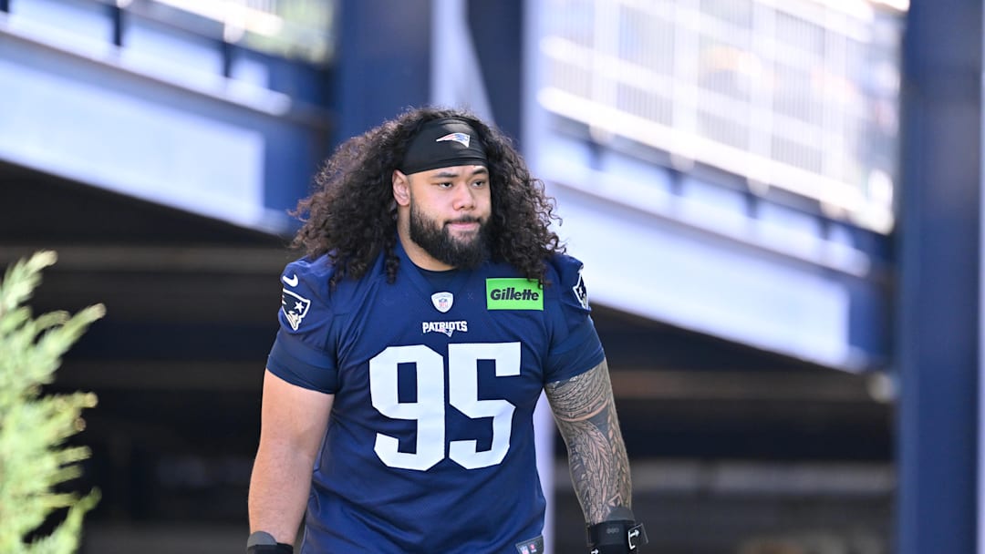 Jul 23, 2025; Foxborough, MA, USA; New England Patriots defensive tackle Khyiris Tonga (95) walks to the practice field for training camp at Gillette Stadium. Mandatory Credit: Eric Canha-Imagn Images Jul 23, 2025; Foxborough, MA, USA; New England Patriots defensive tackle Khyiris Tonga (95) walks to the practice field for training camp at Gillette Stadium. Mandatory Credit: Eric Canha-Imagn Images