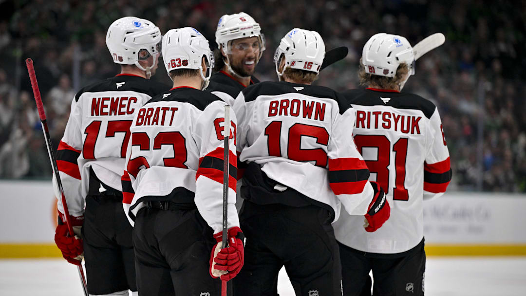 Mar 24, 2026; Dallas, Texas, USA; New Jersey Devils defenseman Simon Nemec (17), left wing Jesper Bratt (63), right wing Connor Brown (16), right wing Arseny Gritsyuk (81) and defenseman Brenden Dillon (5) celebrate a goal scored by Brown against the Dallas Stars during the first period at the American Airlines Center. Mandatory Credit: Jerome Miron-Imagn Images