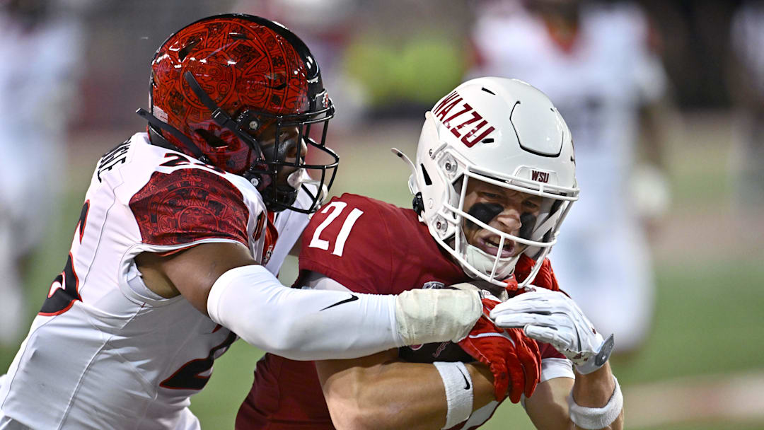 Washington State Cougars wide receiver Carter Pabst (21) is caught from behind by San Diego State Aztecs safety Dwayne McDougle (26) in the first half at Gesa Field at Martin Stadium. Washington State Cougars wide receiver Carter Pabst (21) is caught from behind by San Diego State Aztecs safety Dwayne McDougle (26) in the first half at Gesa Field at Martin Stadium.